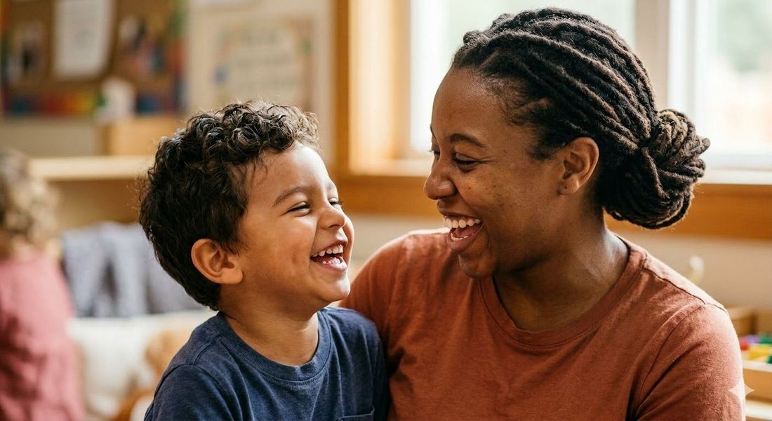 A teacher and child sharing a genuine laugh together